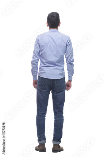 rear view . a young man in jeans looking at a white screen. © ASDF