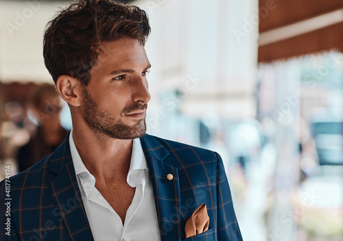Portrait of handsome man in checked suit photo