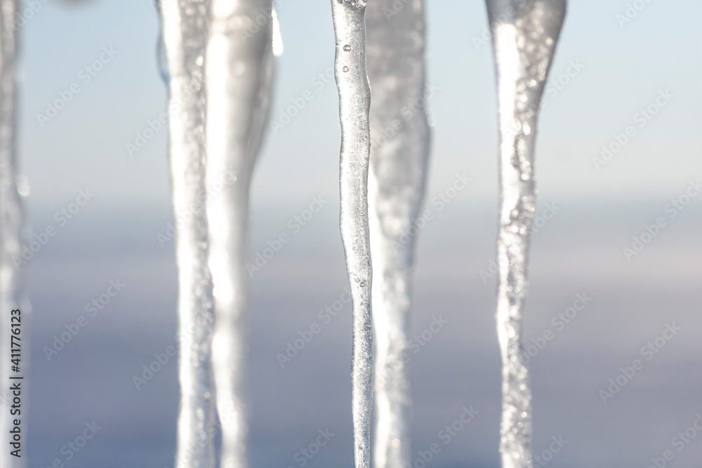 Hanging icicles on a cold winter day Hanging icicles on a cold winter day