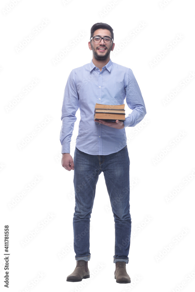 young man with glasses and a stack of books. young man with glasses and a stack of books.