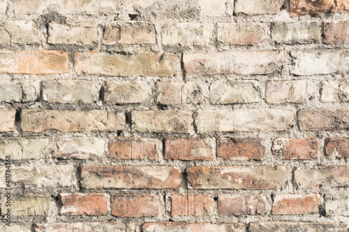 Brick wall background. Urban rustic texture. Antique house exterior wall. Vintage abandoned building architecture. Red brick construction.