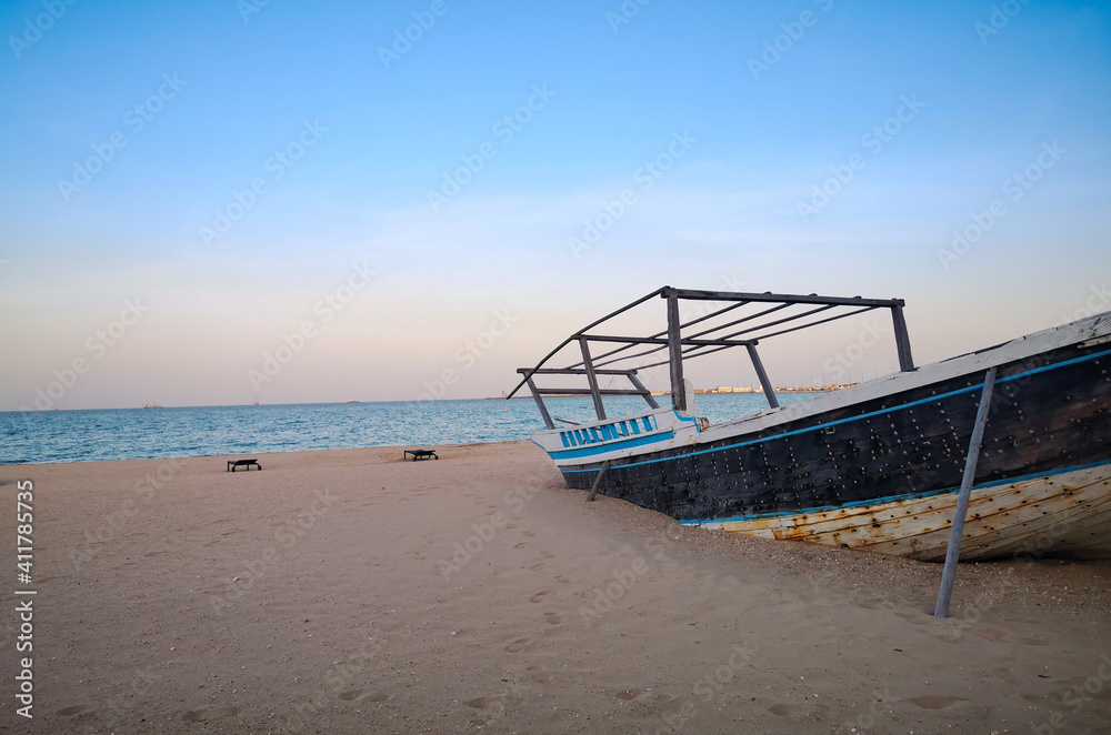 Background images of boats kept at the shore of the wakrah beach in Qatar.