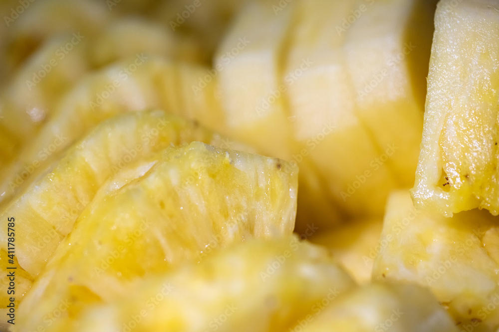 Healthy food. Pineapple fruit on a plate in the cut closeup. Fresh vitamin. Tropical, exotic, fruits background. Healthy food. Pineapple fruit on a plate in the cut closeup. Fresh vitamin. Tropical, exotic, fruits background.
