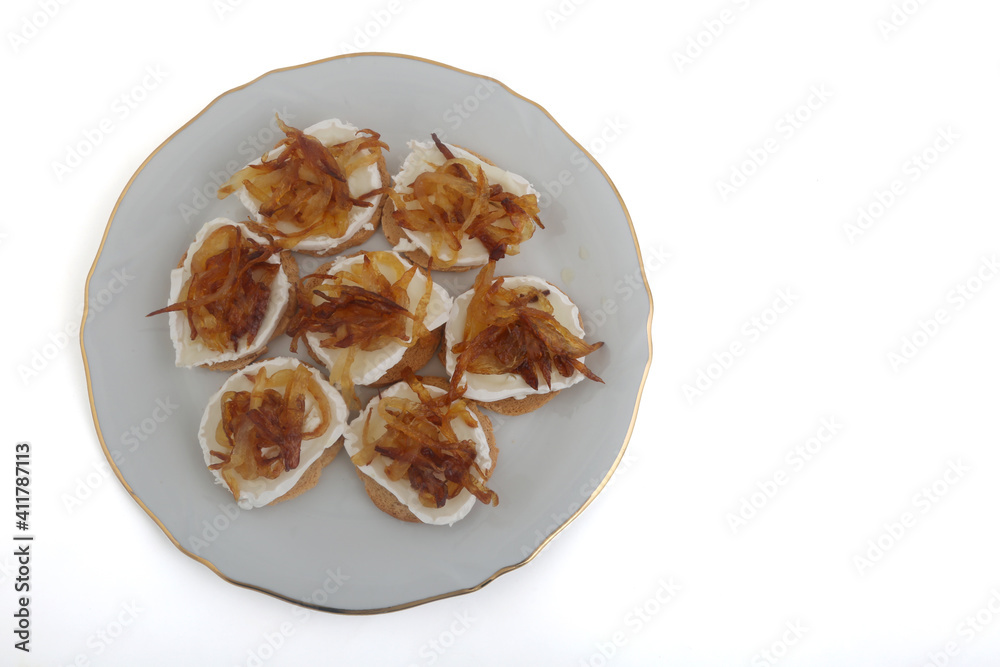 Mozzarella and fried onion toast canape as appetizer Mozzarella and fried onion toast canape as appetizer