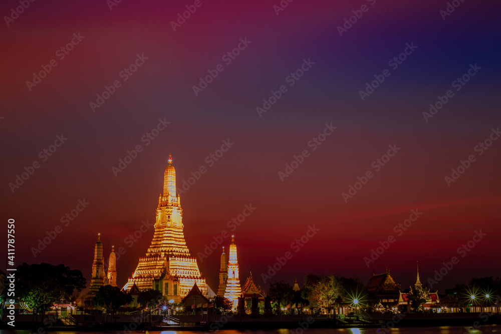 A close-up view of the background of a major tourist attraction in Bangkok of Thailand (Wat Arun Ratchawararam Ratchaworamahawihan) is a large chedi installed on the Chao Phraya River.