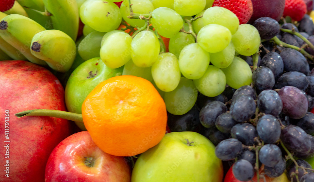 background: Mix of Assorted Fresh fruits at a shop for sale background: Mix of Assorted Fresh fruits at a shop for sale
