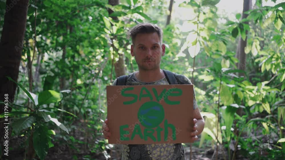 A young man with a sign 