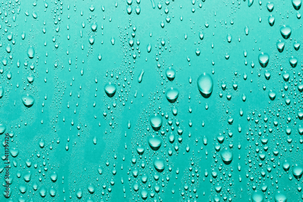 Water drops on blue background, macro