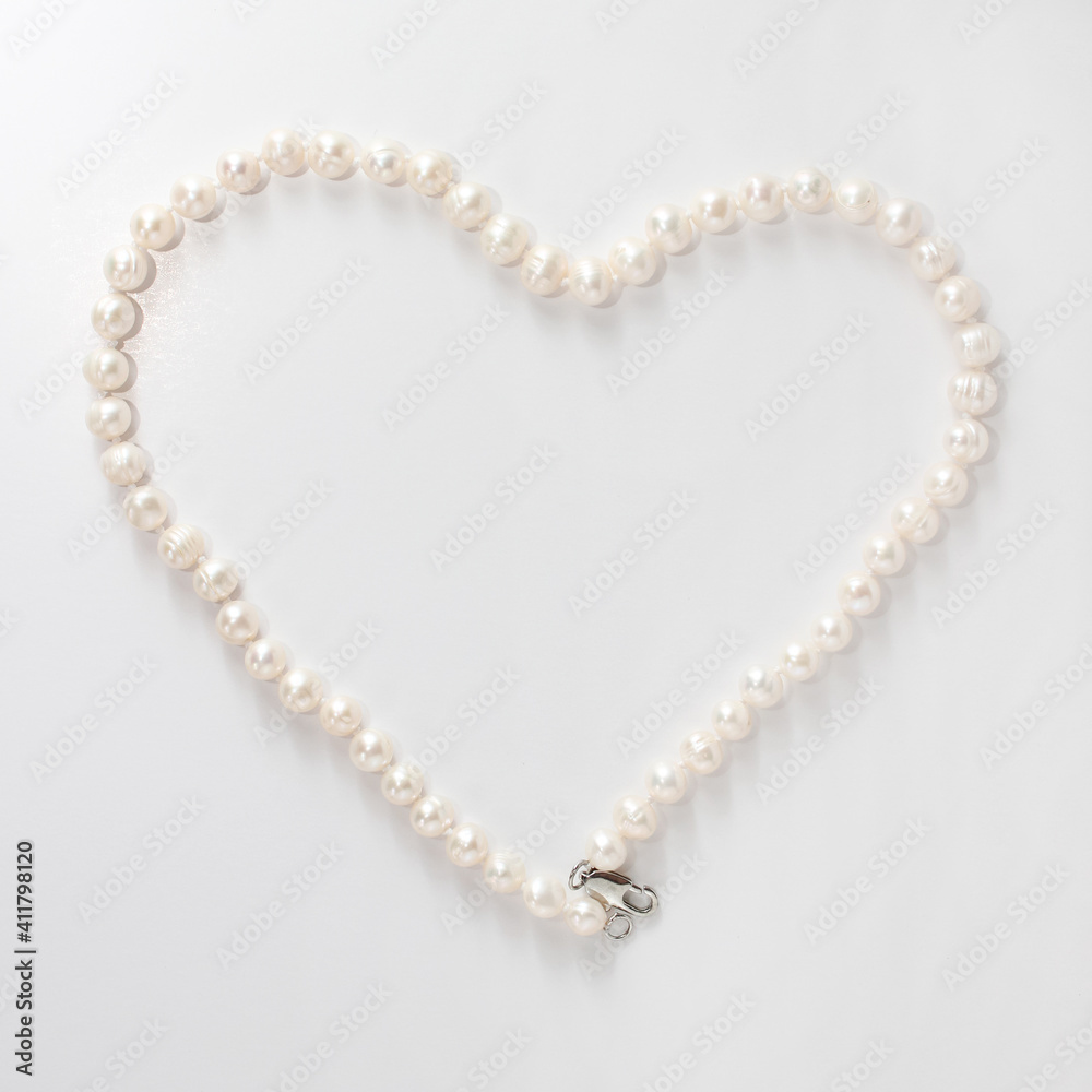 river pearls in the shape of a heart on a white background river pearls in the shape of a heart on a white background