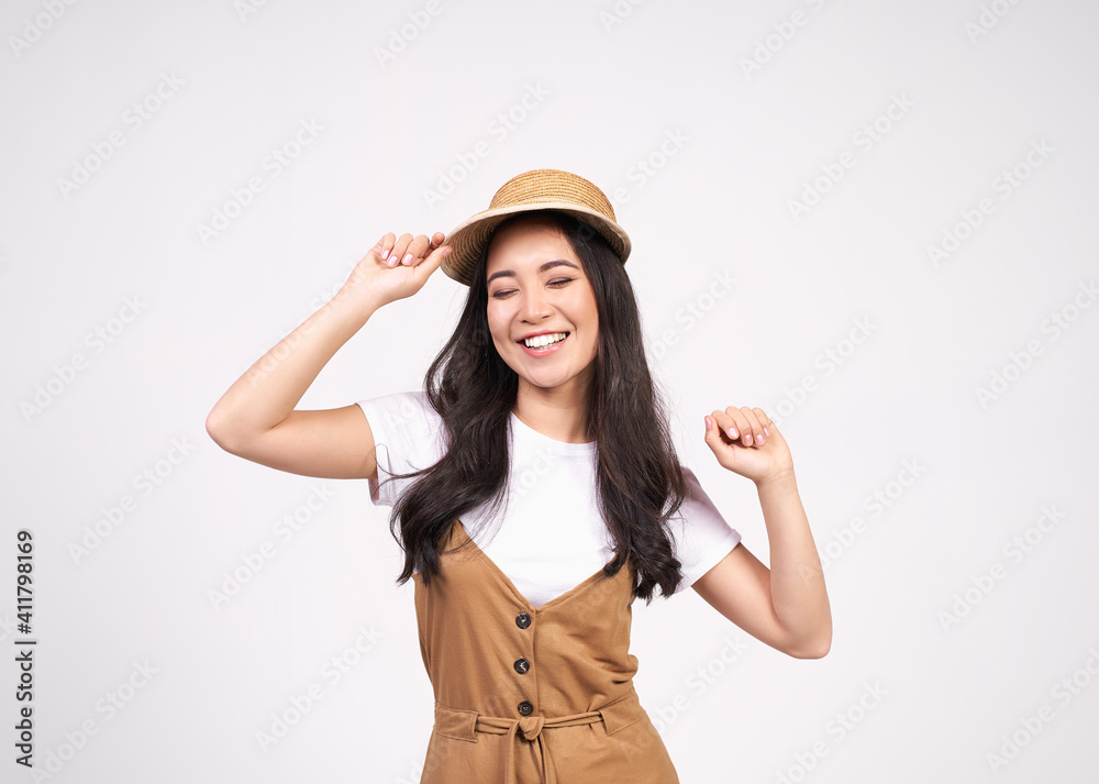 Young beautiful Asian lady likes to dance to the rhythm of music. Young beautiful Asian lady likes to dance to the rhythm of music.