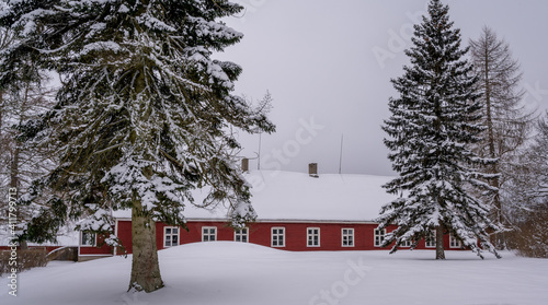 old wooden manor in witner time photo