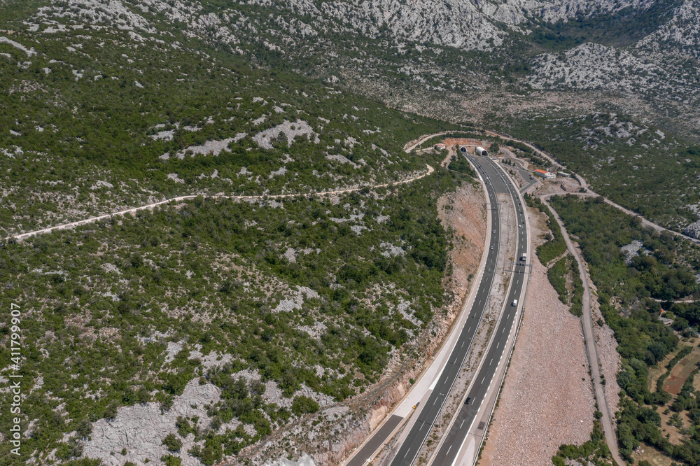 Aerial view of highway tunnel through Tulove Grede near Dalmatia in Croatia