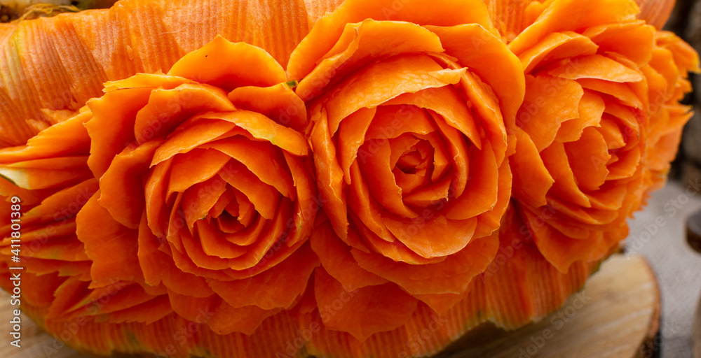 beautifully carved flowers on a pumpkin. art of carving beautifully carved flowers on a pumpkin. art of carving