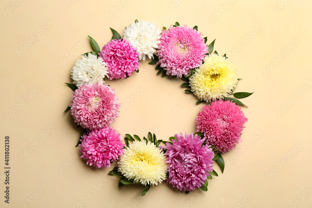 Frame of beautiful asters and space for text on beige background, flat lay. Autumn flowers Frame of beautiful asters and space for text on beige background, flat lay. Autumn flowers