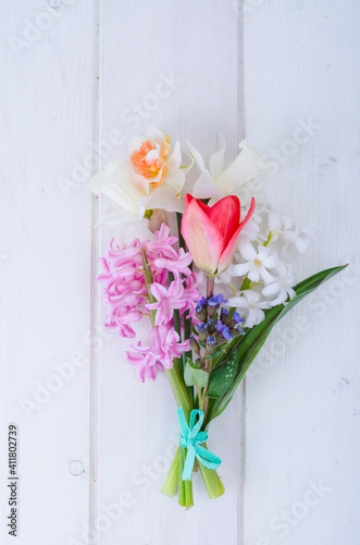 Bouquet of spring garden flowers on white background.