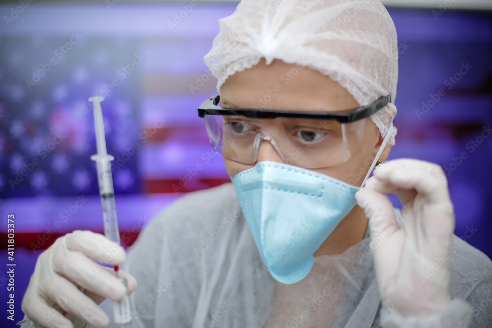 Medica segurando uma seringa de Vacina na prevenção de covid 19 com fundo obstrato e desfocado. Medica segurando uma seringa de Vacina na prevenção de covid 19 com fundo obstrato e desfocado.