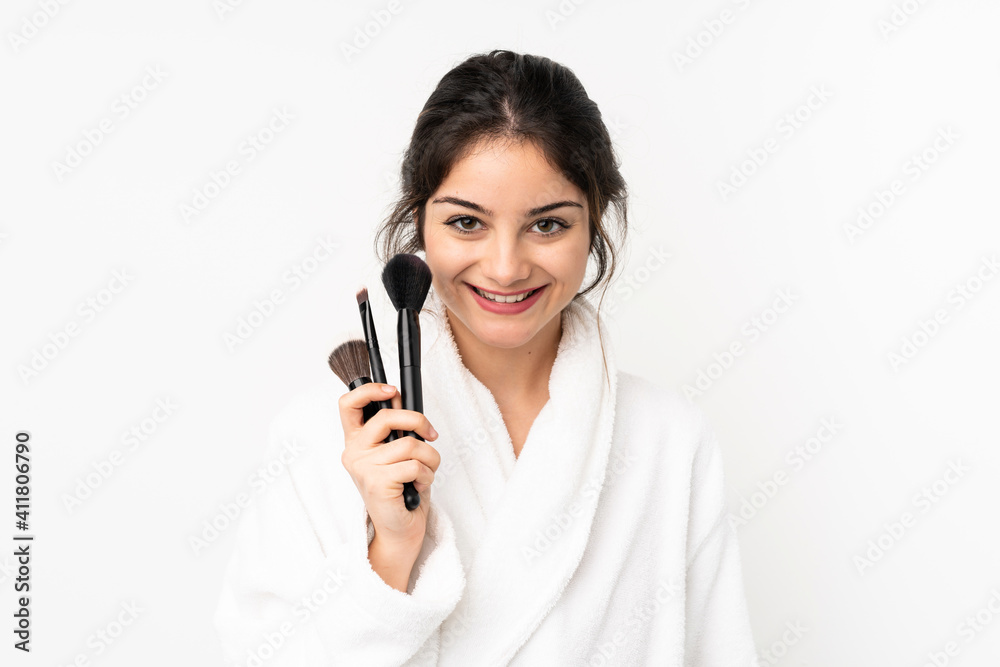Young caucasian woman isolated on white background holding makeup brush Young caucasian woman isolated on white background holding makeup brush