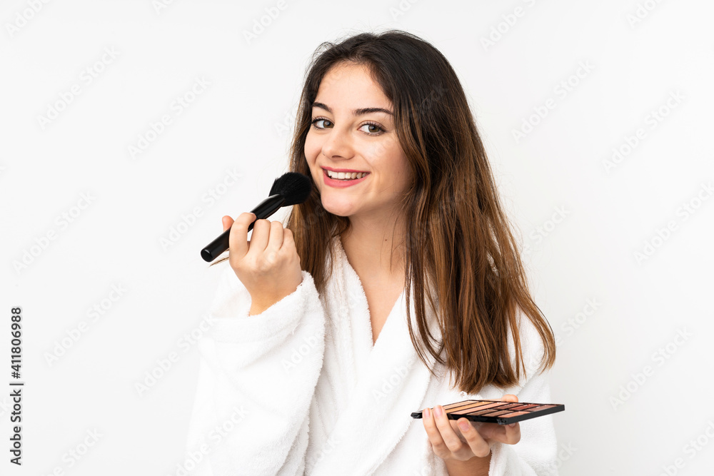 Young caucasian woman isolated on white background with makeup palette Young caucasian woman isolated on white background with makeup palette