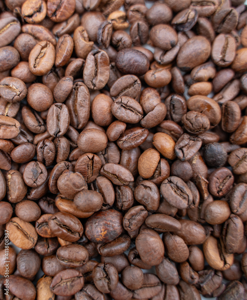 Background image with roasted brown coffee beans Background image with roasted brown coffee beans