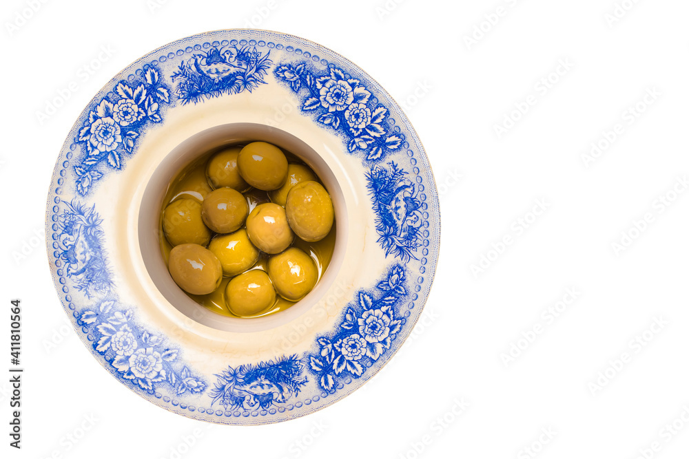 Salted green bone olives with olive oil isolated. Salted green bone olives with olive oil isolated.