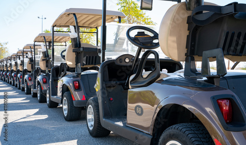 Fotografija Background image of multiple golf carts parked in order.