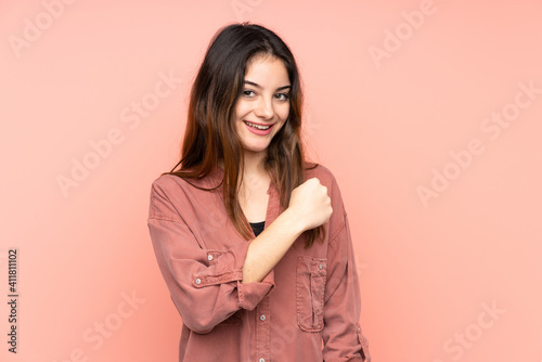 Young caucasian woman isolated on pink background celebrating a victory © luismolinero