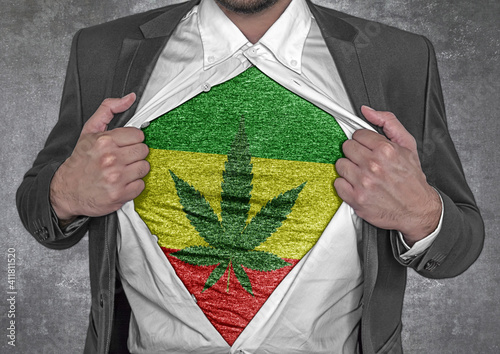 Business man show t-shirt flag of Rassta rips open his shirt