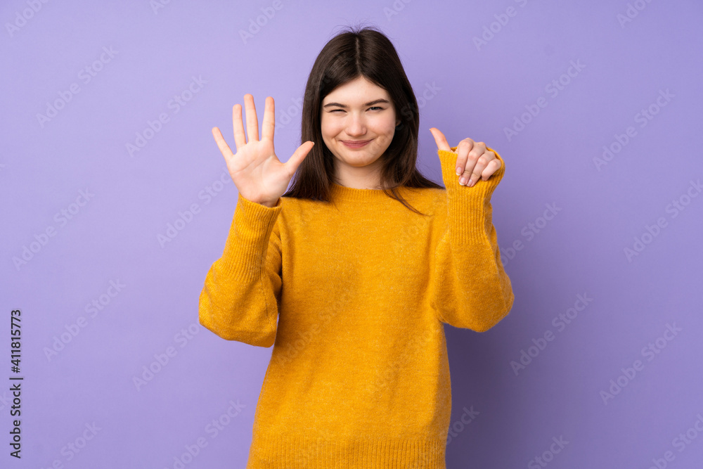 Young Ukrainian teenager girl over isolated purple background counting six with fingers Young Ukrainian teenager girl over isolated purple background counting six with fingers