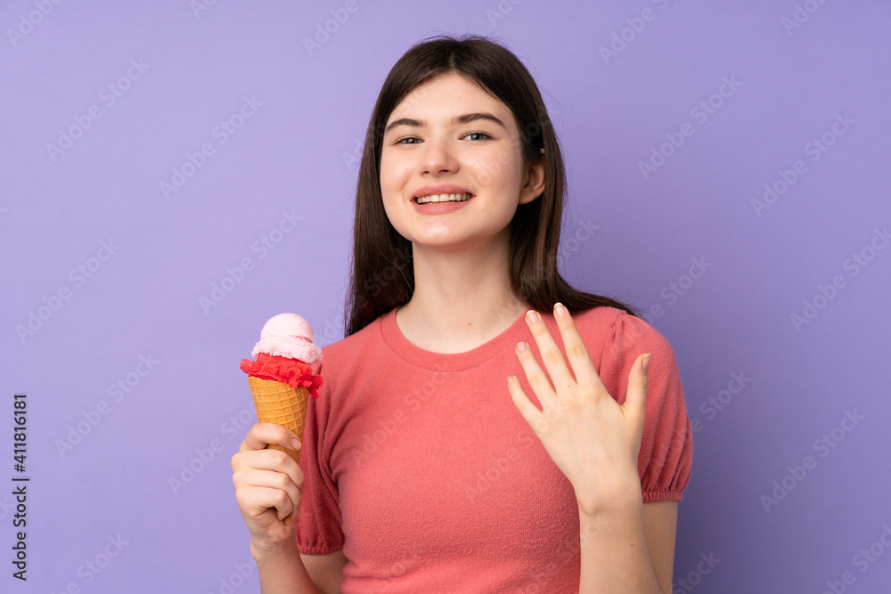 Young Ukrainian teenager girl holding a cornet ice cream over isolated purple background inviting to come with hand. Happy that you came