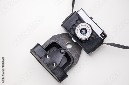 Old, retro, vintage camera over white background