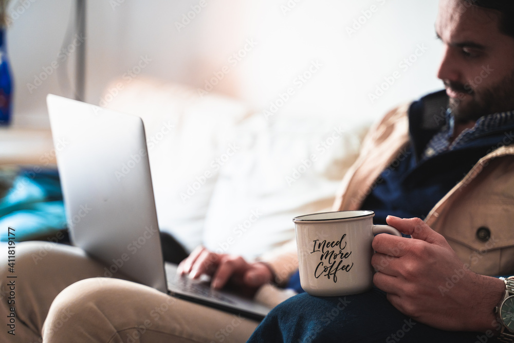man working at home drinking coffee