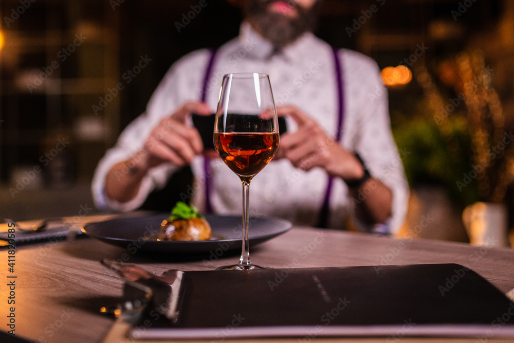 young man in restaurant with wine