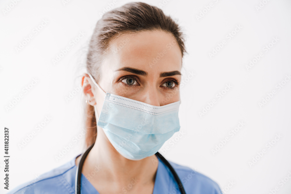 Beautiful young woman doctor in medical mask Beautiful young woman doctor in medical mask