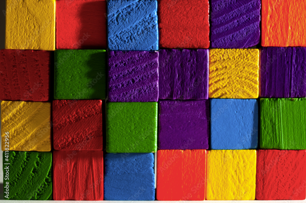 Obraz premium wooden colorful cubes wall close-up view
