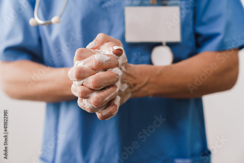 Close up of a female doctor washing her hands