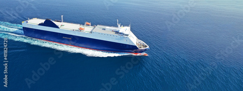 Aerial drone ultra wide photo of large RoRo (Roll on-off) vessel cruising the Atlantic Ocean deep blue sea © aerial-drone