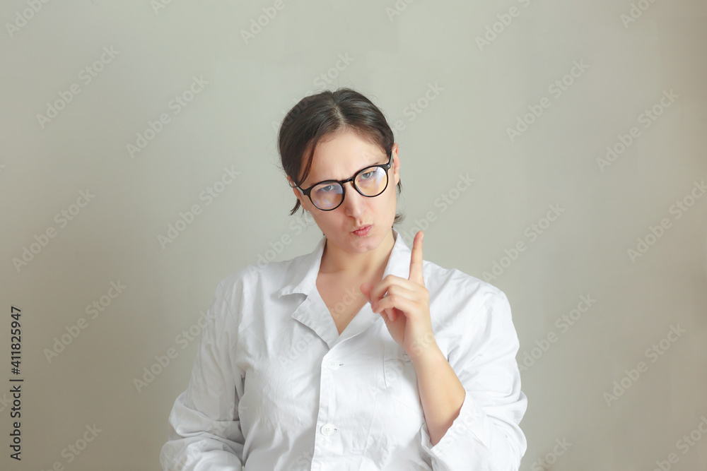 Young beautiful woman doctor is waiting for new visit, smiling and positive doctor