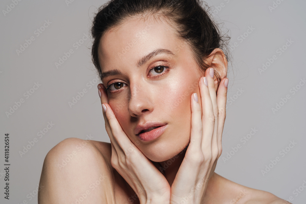 Beautiful half-naked woman posing and looking at camera Beautiful half-naked woman posing and looking at camera