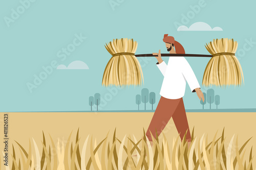 A farmer with a bunch of straws on his shoulder walks through a farm