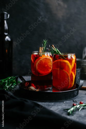 Hot mulled wine in a transparent glass on the table photo