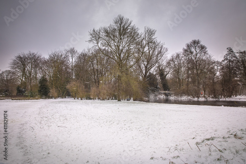 winter view of the white Vondelpark under the snow in Amsterdam