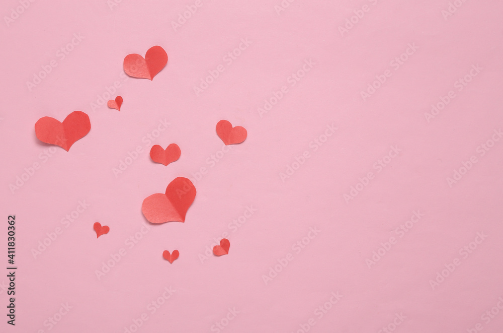 Paper Cut Red hearts on pink background. Copy space