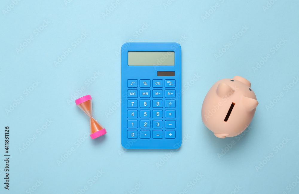 Calculator, piggy bank and hourglass on a blue background. Income calculation, investment, deposit Calculator, piggy bank and hourglass on a blue background. Income calculation, investment, deposit