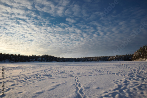 Frozen snow covered lake in the winter