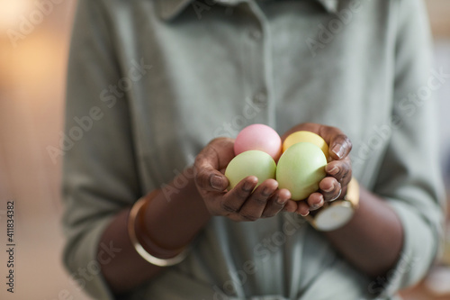 Canvas Print Close up of unrecognizable African-American woman holding pastel colored easter