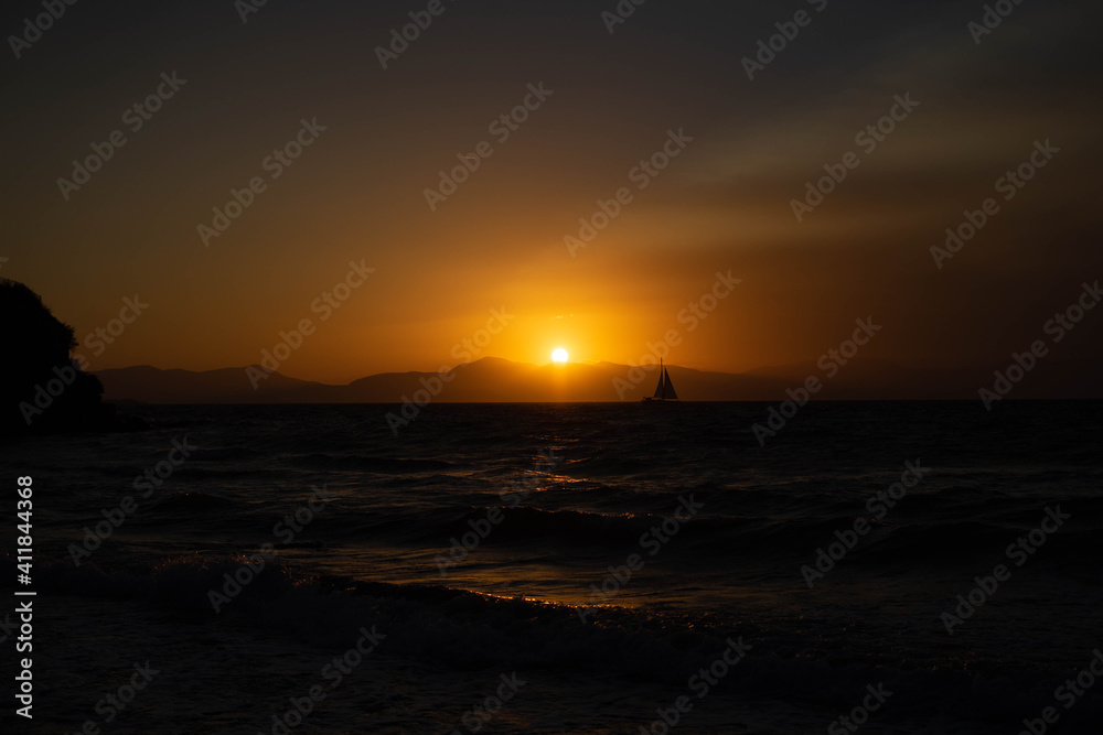 sunset in greece sea with waves