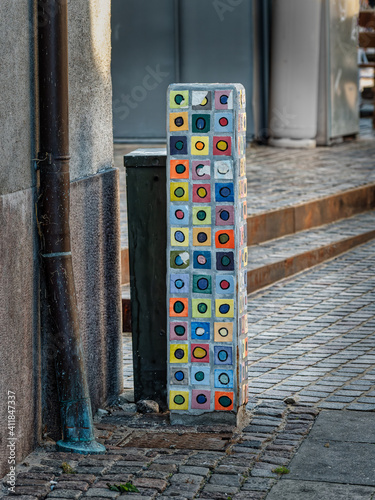 Decorated stone on footpath in Nykoebing F in rural Denmark photo