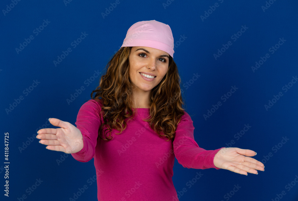Hopeful woman wearing a pink scarf Hopeful woman wearing a pink scarf