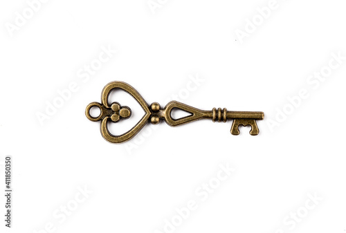 Old antique key on white ba...