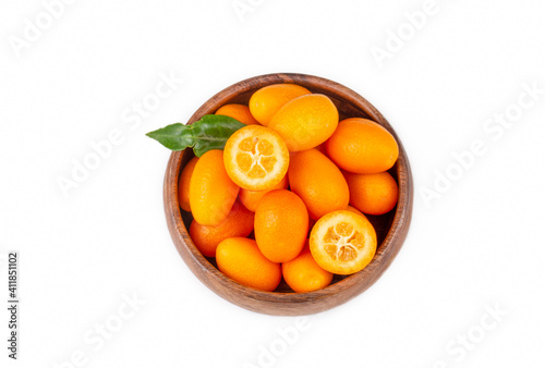 Top view of bunch of fresh kumquats in the organic food market. Some kumquats is cutted © Esin Deniz